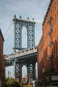 The Manhattan Bridge framed between buildings in New York City, United States