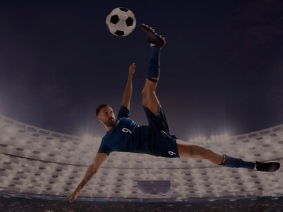 Professional soccer players in action on stadium field, football match