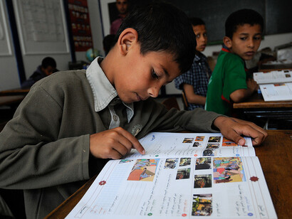 Young Moroccan students are busy learning in school. Arabic and Amazigh are the two official languages of Morocco, and both have a long and influential history there