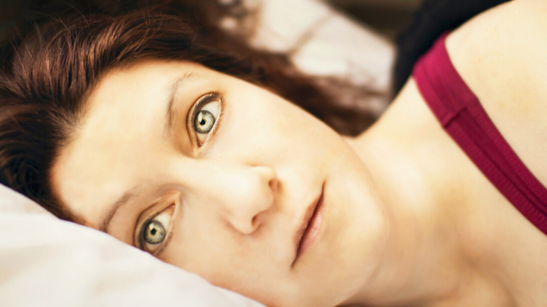 A woman unable to sleep, poor sleep quality has been linked to several medical conditions 