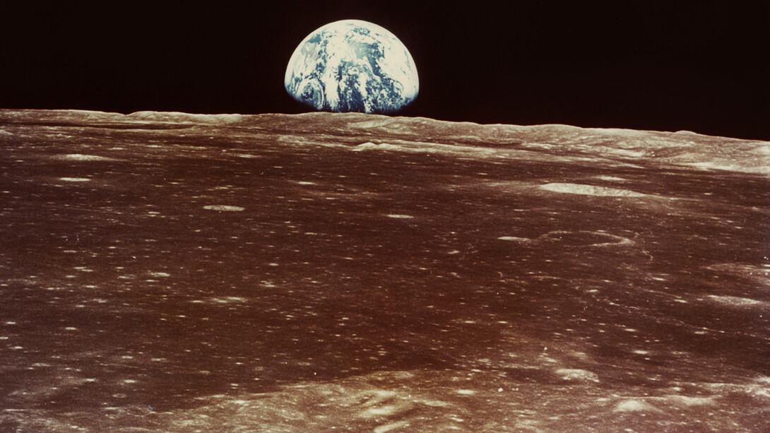 Nasa, Apollo 11, Mike Collins, "Earth rise over Moon (Smyth's Sea)", July 20, 1969, c-print on matte kodak paper, 19,2 (20,2) x 24,3 (25,4) cm, Courtesy: Daniel Blau Munich/London © Nasa © Mike Collins