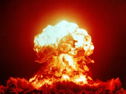 Nuclear explosion erupting and engulfing its surroundings