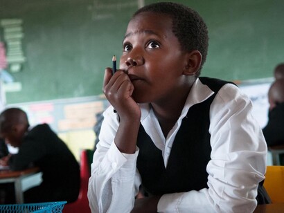 South Africa child busy listening during class time, at school