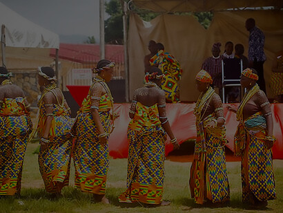 Adorned in the radiant hues of Kente fabric, these enchanting Krobo girls captivate the scene during a festival in Ghana