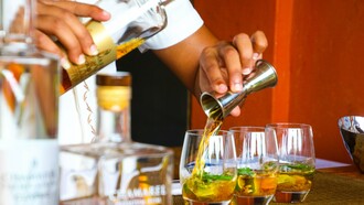 Bartender making drinks for patrons