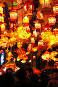 As dusk falls over Nagasaki, Japan, the vibrant red and yellow glow of thousands of lanterns transforms the streets into a breathtaking spectacle, inviting all to experience the magic of the Lantern Festival in the city