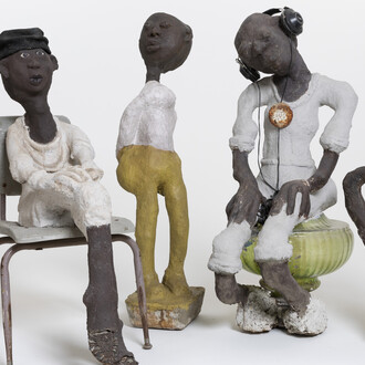 (from left) Horn Player: Louis Armstrong Series, c. 1985–c. 1999; concrete, paint, and mixed media; 32 3/4 x 9 1/2 x 13 1/2 in. Rosa Parks, c. 1985–c. 1999; concrete, paint, and mixed media; 40 x 18 3/4 x 29 in. untitled, c. 1985–c. 1999; concrete, paint, and mixed media; 44 1/2 x 9 1/2 x 12 in. Issues, c. 1985–c. 1999; concrete, paint, and mixed media; 46 x 18 x 25 in. Woman with Fancy Earrings, c. 1985–c. 1999; concrete, paint, and mixed media; 36 x 18 x 10 in. John Michael Kohler Arts Center Collection, gift of Kohler Foundation Inc. 
Photo courtesy of John Michael Kohler Arts Center 
