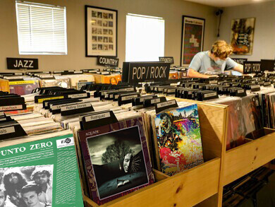 A vintage vinyl record store and a small independent record label workspace