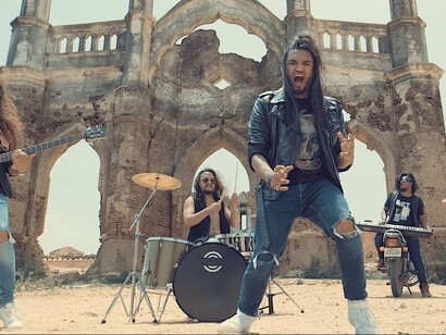 The rock and roll band Girish and the Chronicles in a music video