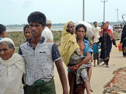 Rohingya refugees crossing the border from Myanmar into Bangladesh