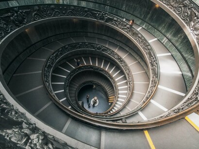 The iconic spiral staircase of the Vatican Museums in Vatican City, reflecting the role of architectural rhythm in cognitive wayfinding