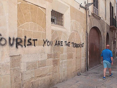 Graffiti serves as a powerful expression of frustrations with the tourism industry