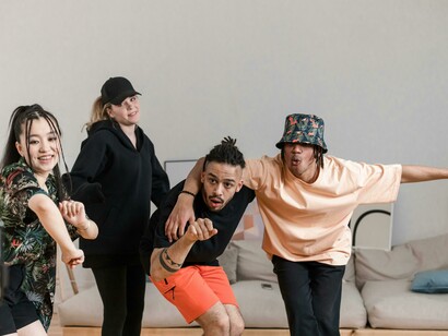 A group dancing together as they record a video for social media