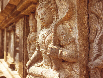 Stone relief carving illustrating the ancient Buddhist cosmology of Thailand