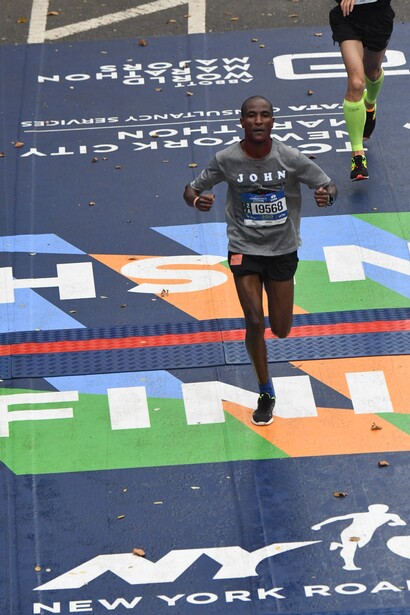 John Metui crossing the finish line at the 2017 TCS New York City Marathon