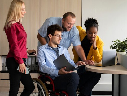 Colleagues in a company committed to Diversity, Equity, and Inclusion (DEI) work together to promote a culture of inclusivity and equal opportunity