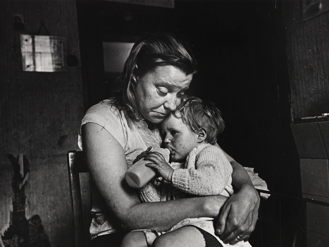 Mrs T and her family of 5 lived in a decaying terraced house owned by a steelworks. She had no gas, no electricity, no hot water, no bathroom. Her cooking was done on the fire in the living room. Sheffield, May 1969 © Nick Hedges / National Media Museum, Bradford
