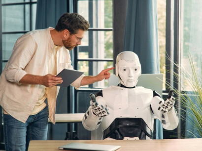 A man and a robot collaborate on everyday tasks at home