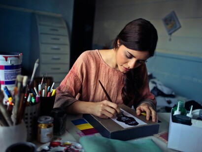 An artist focused and busy drawing 