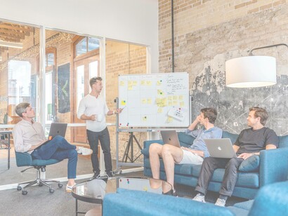 Startup camaraderie in the workspace as employees bond over a common project