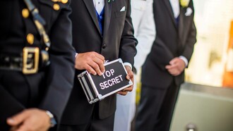 Man holding a top secret sign