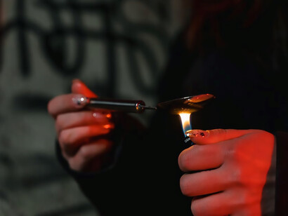 A young woman contemplates engaging in substance use