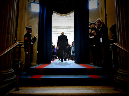 President Donald Trump, dressed in a formal suit and flanked by his family, arrived at his inauguration, stepping out onto the steps of the U.S. Capitol to a crowd filled with both supporters and protesters, signaling the start of a new chapter in American politics