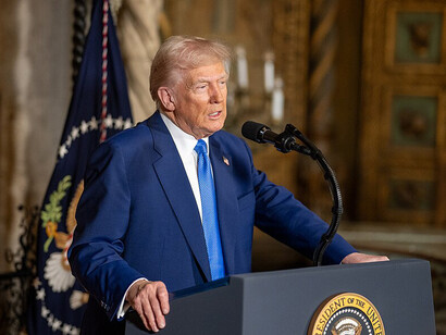 President Donald Trump signs Executive Orders at his Mar-a-Lago resort in Palm Beach, Florida, on Tuesday, February 18, 2025