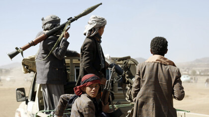 Under the shadow of global trade uncertainty, Houthis and young fighters gear up on the back of a pick up truck in Yemen, symbolising the increasing threat posed by extremist alliances in the Middle East