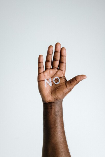 Raised hand says 'no'