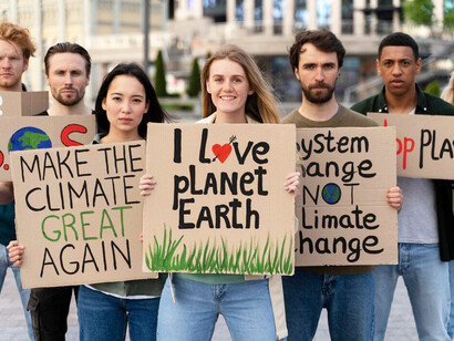 People united in a global warming protest, advocating for ecofeminism, environmental justice, gender equality, and the interconnectedness of women and nature