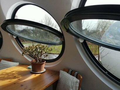 Bolwoningen is a unique housing development of 50 spherical homes situated near a canal in the Maaspoort neighborhood of ’s-Hertogenbosch, Netherlands