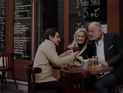 The charm of a family-owned bistro, where patrons savor drinks amidst a welcoming ambiance