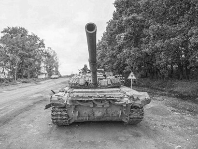A Russian tank positioning its gun and getting ready to fire
