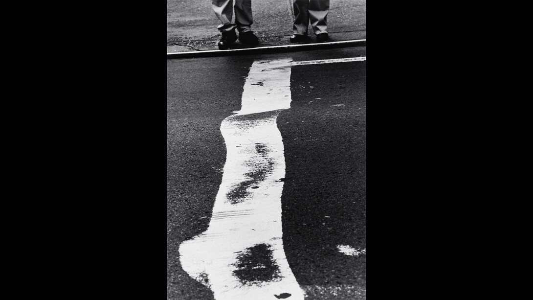 Crosswalk Stripe and Men, 1999, Courtesy Gallery FIFTY ONE | ©Estate of Louis Stettner.
