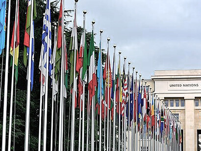 National flags grace the Palace of Nations, the United Nations Office in Geneva, Switzerland