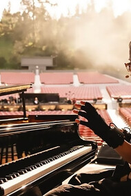 Imogen Heap soundchecking Mi.Mu Gloves effects with the grand piano for a live improvisation
