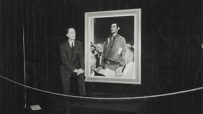 Photograph of Norman Rockwell with Freedom of Speech painting at Four Freedoms War Bond Show, 1943, photographer unknown, collection of Norman Rockwell Museum. © Norman Rockwell Family Agency. All rights reserved.