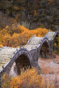 Plakidas Bridge, located near the villages of Kipi and Koukouli in Central Zagori, Greece, is one of the region’s most distinctive stone bridges