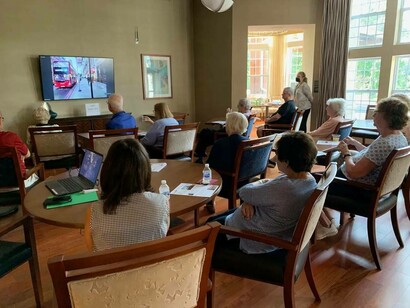 Wowzitude members watching an instructional video