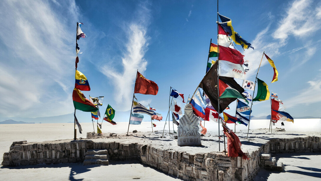 The salt flat gathering spot, with flags visitors left behind, Potosí, Bolivia