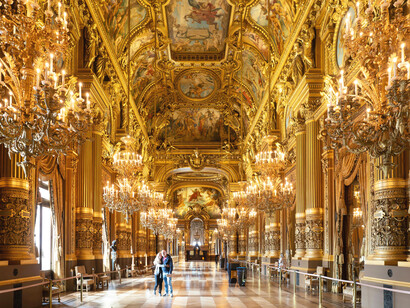 In Paris, France, the Palais Garnier stands as a symbol of opulence, defined by its richly decorated golden spaces and grand design