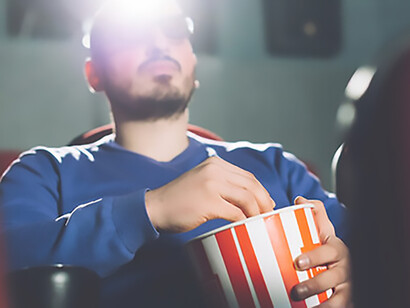 Man looking at cinema screen