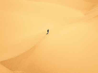 A hole is dug in the sand the size of the person taking the bath