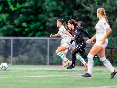 Two football players locked in an intense moment, reflecting the performance-driven nature of traditional sports 