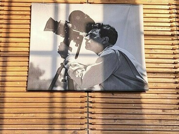 A black-and-white image of a cinematographer at Cineteca Nacional Chapultepec, Mexico City, Mexico, representing the artistry and dedication behind every film