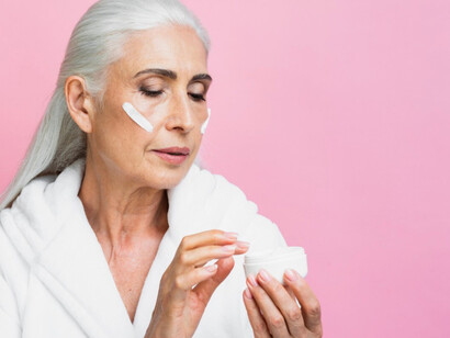 An older women showcasing the billion dollar industry of beauty products to keep up with the forever young look 