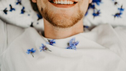 A happy man, smiling, in a good mood and good mental health condition, at peace