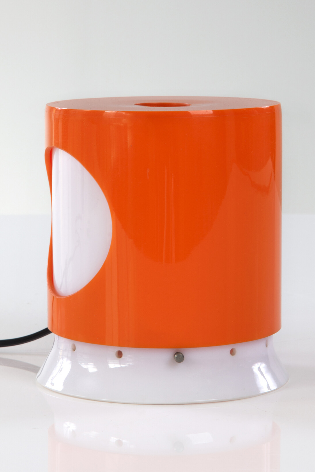 "Lamp with Rotating Shade" in white and colored Polystyrene plastic. Designed by Joe Colombo for Kartell, 1965. 5" L x 5" W x 6" H. Photo by Sherry Griffin for R & Company