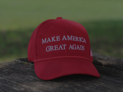 A vibrant red cap boldly displaying the iconic phrase "Make America Great Again."
